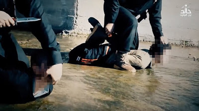 See the Heart Broken Pictures Of A 6-Year-Old Boy Assists ISIS Executioner In Beheading Two Prisoners [Graphic Photos]