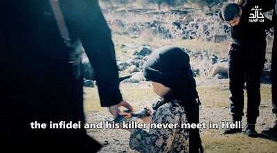 See the Heart Broken Pictures Of A 6-Year-Old Boy Assists ISIS Executioner In Beheading Two Prisoners [Graphic Photos]