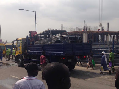 PHOTOS: Lucky Governor Fayose Cheats Death As His G-Wagon Catches Fire In Lagos