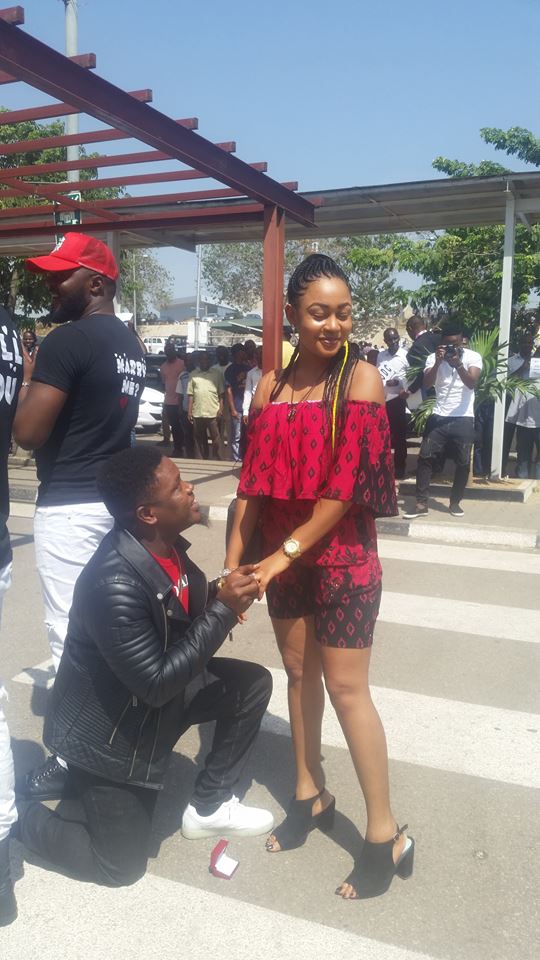 Two Nigerians Comedians Proposes To Their Girlfriends At Abuja Airport, Same Time [Photo]