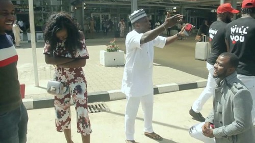 Two Nigerians Comedians Proposes To Their Girlfriends At Abuja Airport, Same Time [Photo]