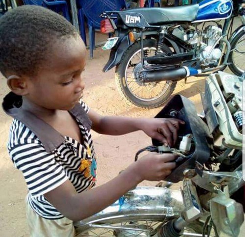 Meet 5-Yr-Old Boy Who Repairs Motorcycles To Pay His School Fees In Benue