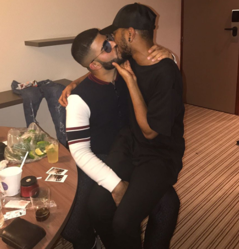 Viral Photo Of Singer Bryson Tiller Kissing Rapper NAV While Sitting On His Laps