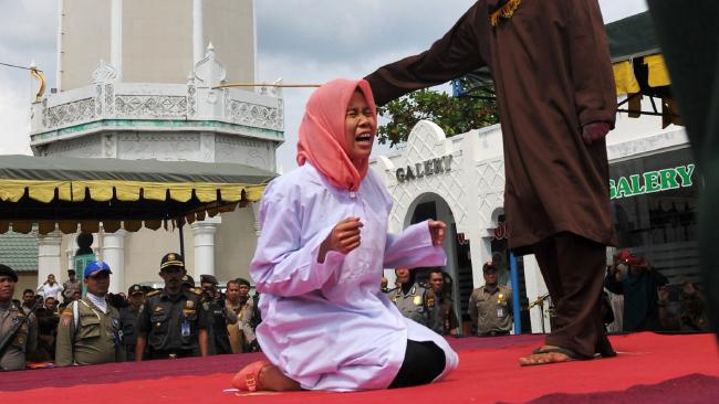 An Indonesian Woman Caned Openly for Pre-Marital Offenses