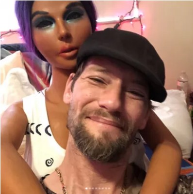 Man Shares Loved Up Photos Of Him With His S*X Doll K*Ssing And Smoking M*Rijuana [Photos]