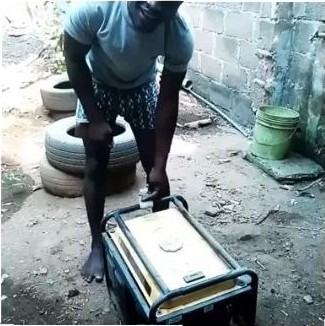 Shocker!!! Nigerian Man Carries Generator With His Teeth [Photos] 