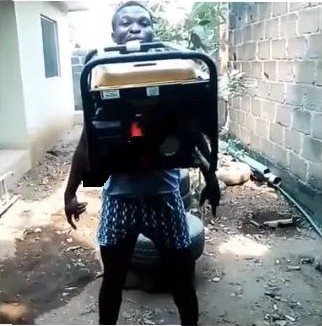 Shocker!!! Nigerian Man Carries Generator With His Teeth [Photos] 
