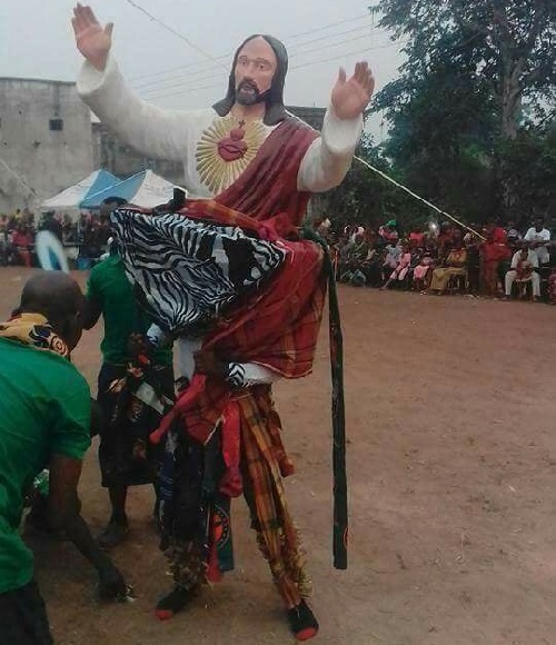 Outrage Sparked As Masquerade Uses Statue Of Jesus Christ For Performance [Photos]