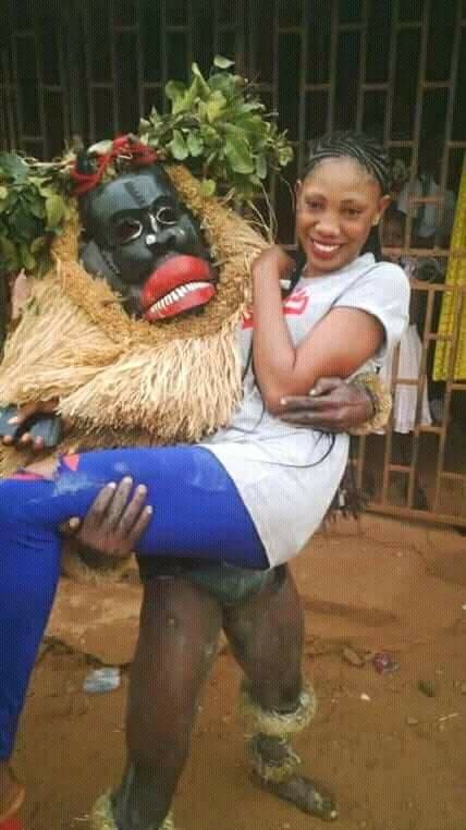 Mixed Reaction as Masquerade Was Spotted Carrying A Beautiful Lady