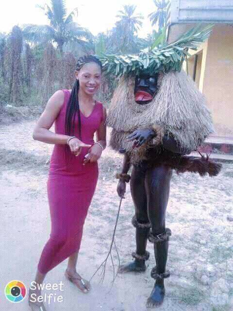 Mixed Reaction as Masquerade Was Spotted Carrying A Beautiful Lady