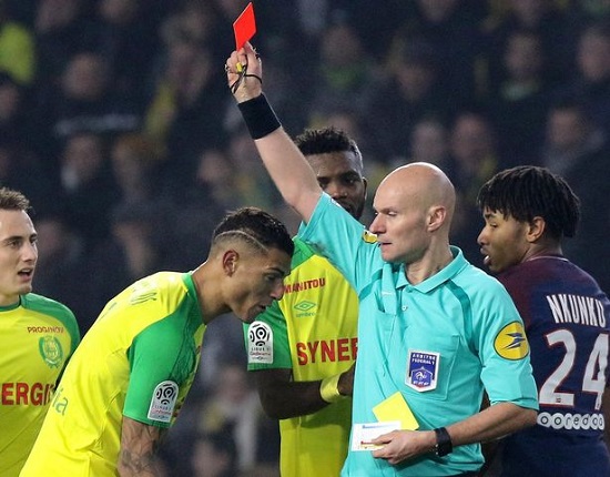 Angry Referee Kicks a Player Before Giving Him a Red Card [Photos]