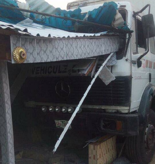 Salesgirl Cheats Death As Truck Rams Into Her Shop In Delta State [Photos]