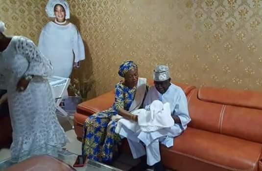 Excited Grandfather, Bola Tinubu Cradles His New Grandson Born Through Surrogacy [Photos]