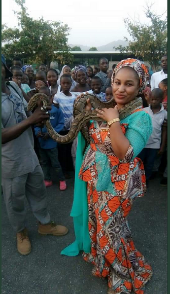 Photos Of Young Pretty Lady Posing With Huge Python And Hyena In Kaduna State [Photos]