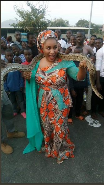Photos Of Young Pretty Lady Posing With Huge Python And Hyena In Kaduna State [Photos]
