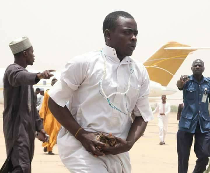 Serious Pandemonium In Kano Airport As Atiku Abubakar Shares Money On Arrival [Photos]