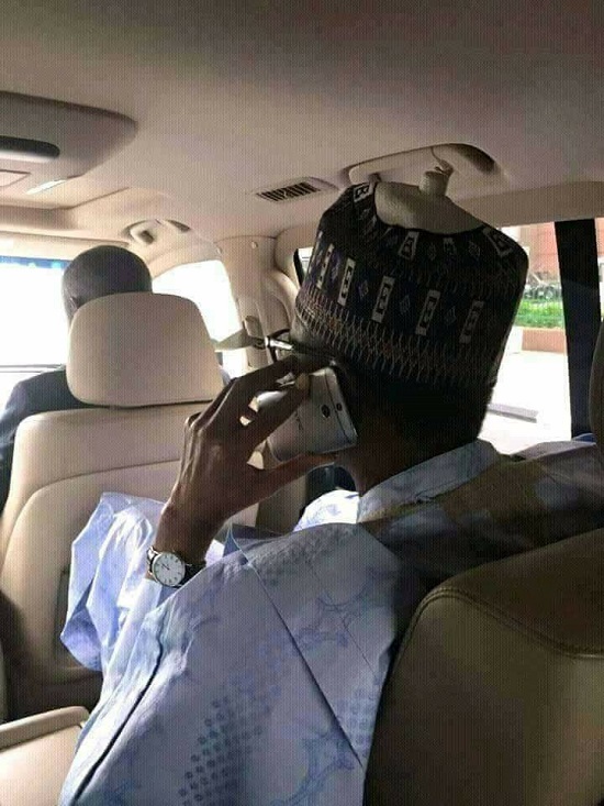 Nigerians React to Photo of President Buhari Using a Very Simple Phone.