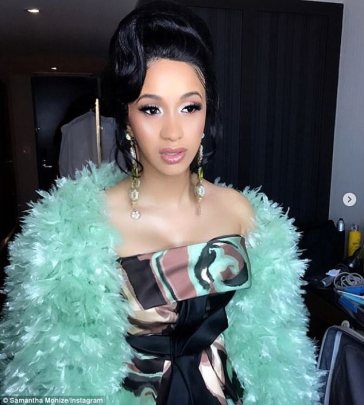 Cardi B draws more attention to her ‘baby bump’ with giant bow over her belly [Photos]