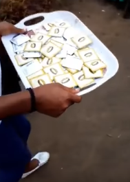 TRENDING: Randy Woman Shares Condoms for Guests At Her Daughter's Child Dedication In Asaba, Delta