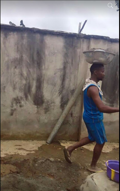 Unemployed Nigerian Graduate Spotted Working as A Bricklayer [Photos]