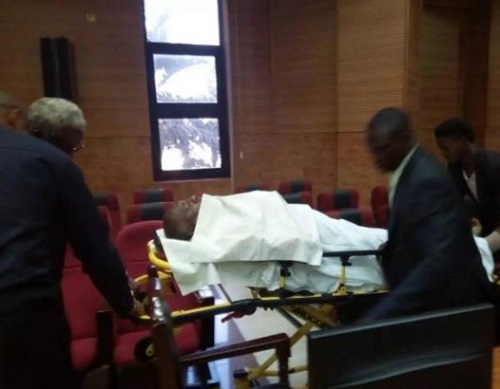 Ex- PDP Spokesman Olisa Metuh Appears in Court On Stretcher [Photos]