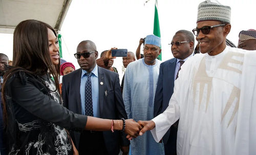 Nigerians React To Buhari’s Handshake With Naomi Campbell  