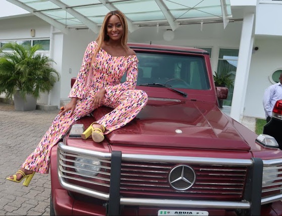 Billionaire Daughter, Dj Cuppy Poses On Her Bulletproof G-Wagon