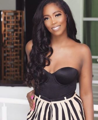 Excited Tiwa Savage, Poses by The Street Named After Her