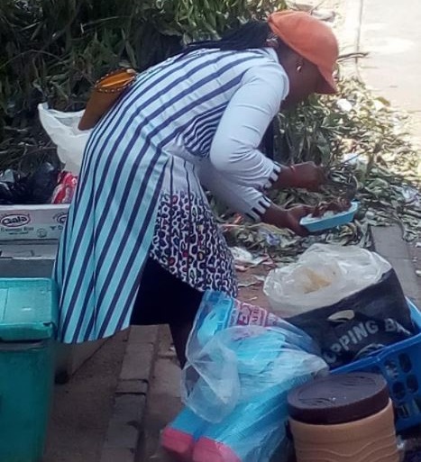 Photos of University Graduate Currently Hawking Food in Abuja [Photos]