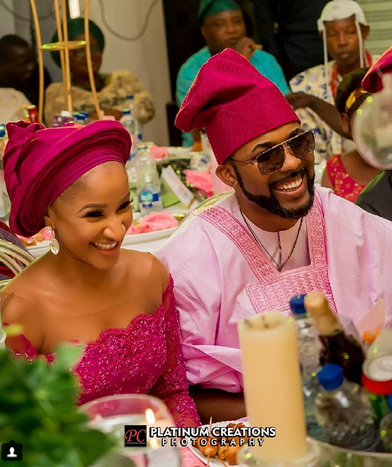 Photographer Captures Banky W Adjusting Adesua’s Gele