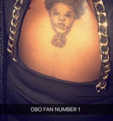 Die hard Female fan, gets a Davido tattoo beneath her boobs [Photos]