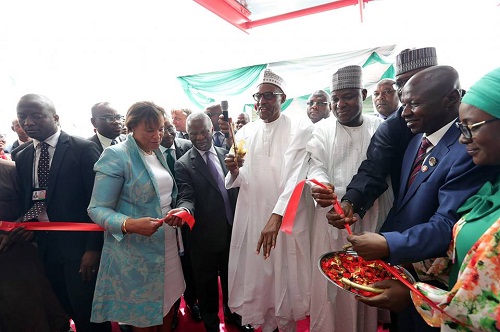 Buhari spotted Counting ‘Looted’ Dollars as He Commissions New EFCC Office in Abuja