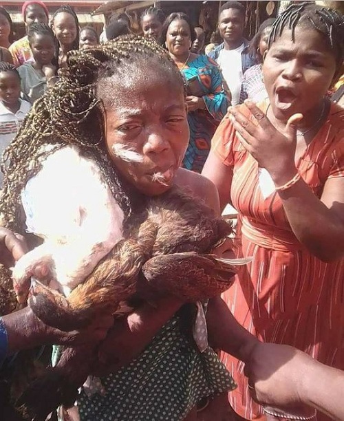 Nigerian Lady Stripped Unclad After She Was Caught Stealing 8 Chickens in Benin [Photos]