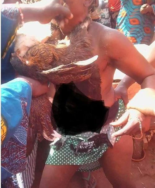 Nigerian Lady Stripped Unclad After She Was Caught Stealing 8 Chickens in Benin [Photos]