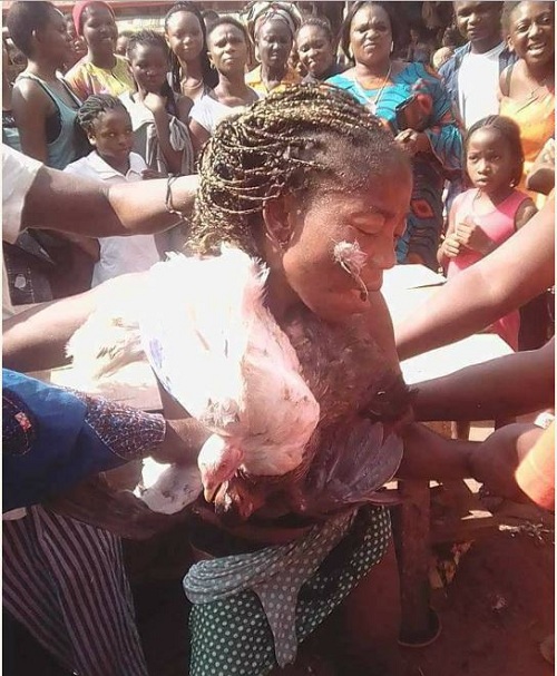 Nigerian Lady Stripped Unclad After She Was Caught Stealing 8 Chickens in Benin [Photos]