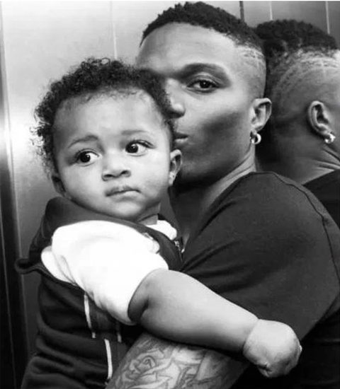 Wizkid Reunites with 3rd Son, Zion, As He Arrives In London [Photos]