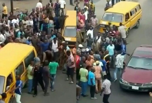 Policeman Flee For His Life As Angry Danfo Drivers Beat Him Mercilessly Over N100 Bribe [Video]