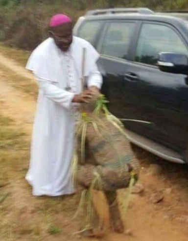 Rev. Father Spotted Hugging and Praying For Masquerades [Photos]