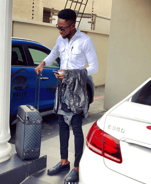 #BBNaija: FLY BOY, Miracle Looks Dapper In New Photos, As He Shows Off His SUV Car