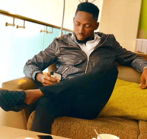 #BBNaija: FLY BOY, Miracle Looks Dapper In New Photos, As He Shows Off His SUV Car