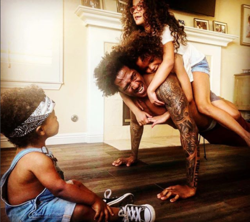 Aww!!! Heart Melting Photo Of Nick Cannon Using His Twin Kids Monroe And Moroccan To Work Out [Photo]
