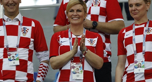 See Photos Of Croatian Female President At The World Cup, That Is Making Football Fans Drool On Bench!