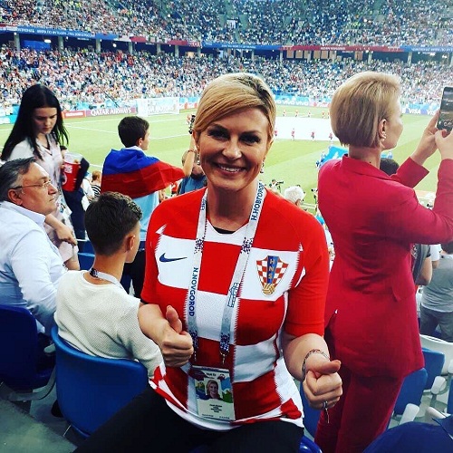 See Photos Of Croatian Female President At The World Cup, That Is Making Football Fans Drool On Bench!