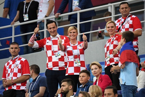 See Photos Of Croatian Female President At The World Cup, That Is Making Football Fans Drool On Bench!
