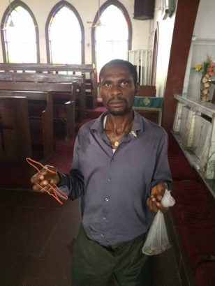 More Photos of the Man Caught Red-Handed While Using Wire to Steal From a Tithe Box in Port Harcourt