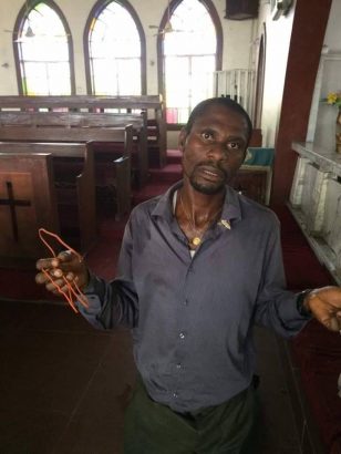 More Photos of the Man Caught Red-Handed While Using Wire to Steal From a Tithe Box in Port Harcourt