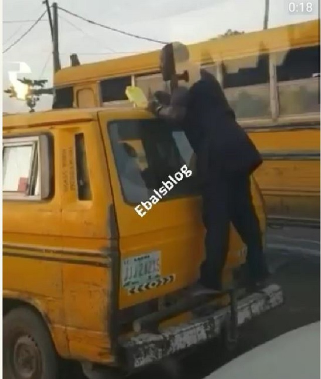 #OnlyInLagos: Man spotted Eating Breakfast on the Back Of a Moving Bus [Photos]