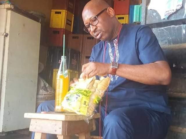 2019 Election: Hon Patrick Obahiangbon Spotted Eating a Loaf of Bread [Photos]