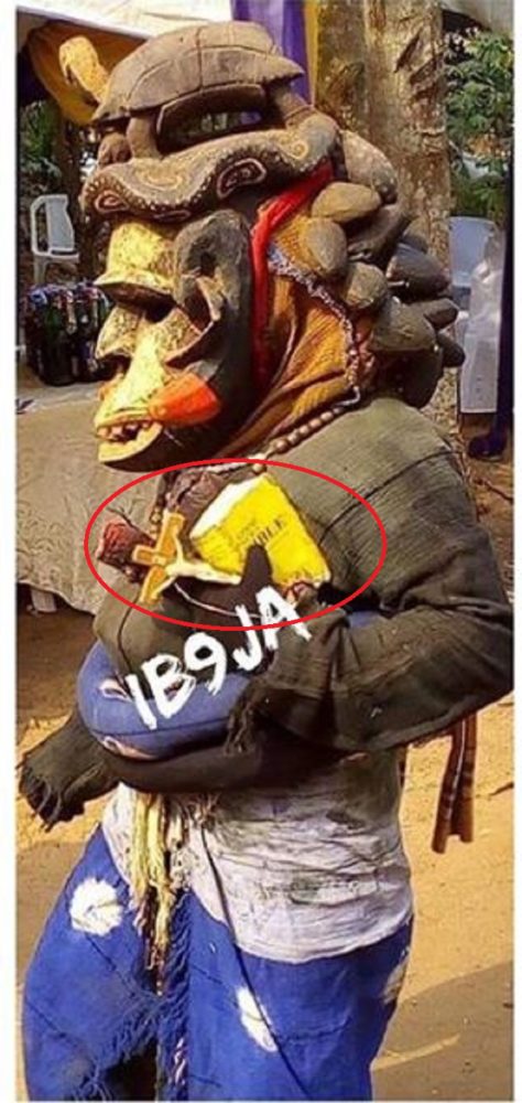 Photos of Masquerade As He Steps Out With His Bible and Crucifix in Anambra State