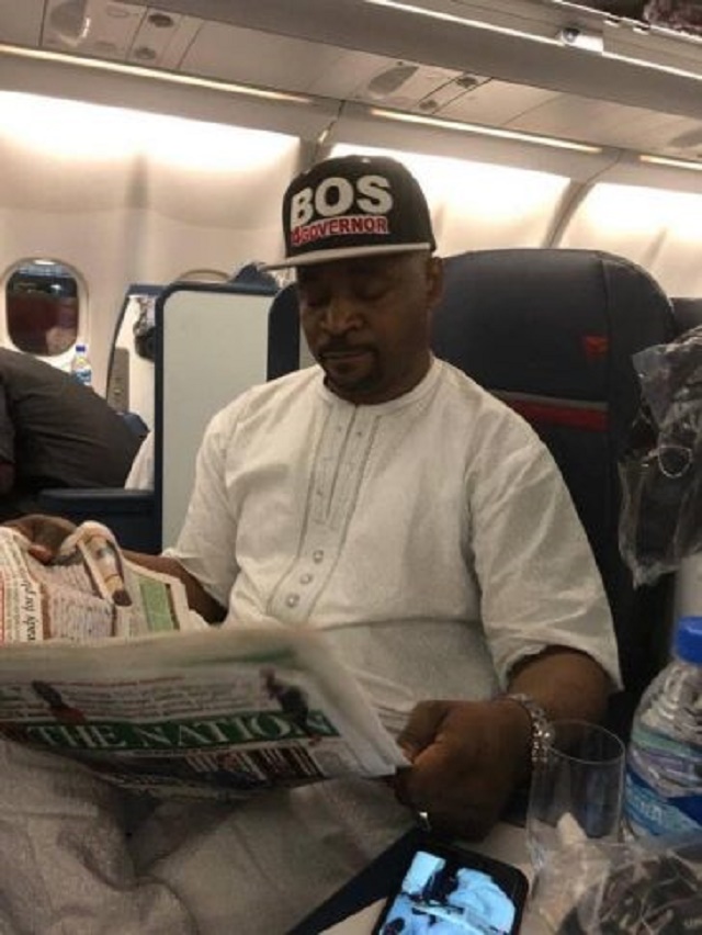 Photos of MC Oluomo On Board a Plane to United States after Getting Stabbed